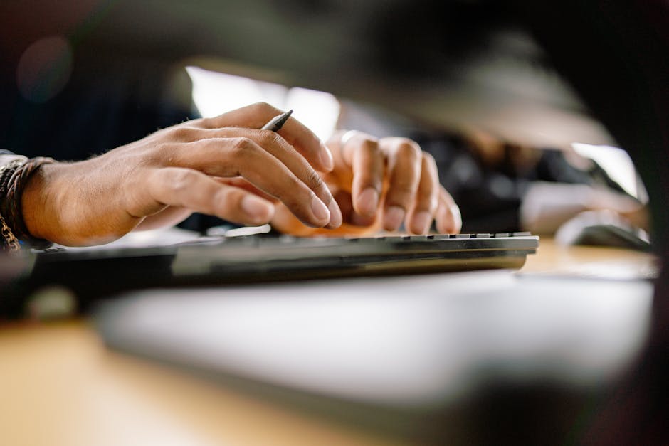 Close-up of a person writing a detailed reconsideration note on a laptop for Google Search Console