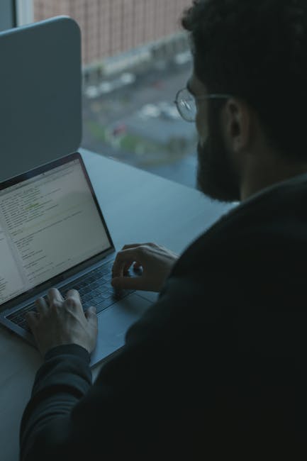 Security analyst reviewing logs on a laptop during WordPress incident triage