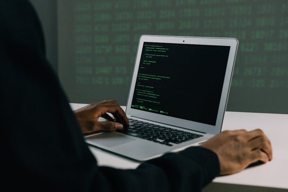 Person viewing security logs on a computer, suggesting attack patterns to search for