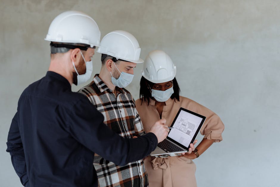 Small team reviewing a security checklist on a laptop, representing a 30-day WordPress protection plan